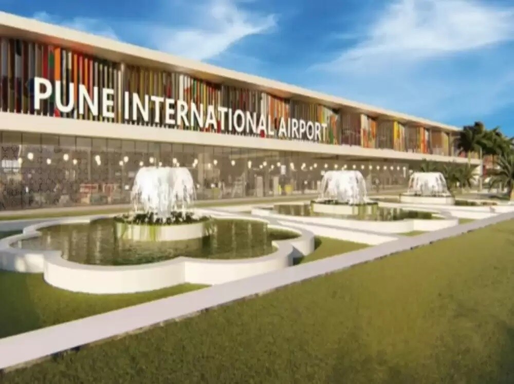 Pune international Airport_a building that has a fountain in front of it