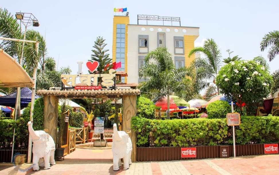 Sarita Vihar_a man and a woman are walking down the street