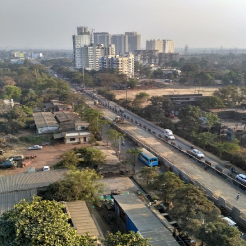 Ashok Nagar_a train going down the tracks in a city