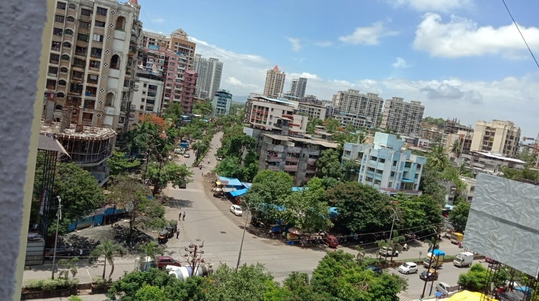 Kalyan West_a city street filled with lots of tall buildings