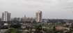 Khadakpada_a city with tall buildings and a sky background