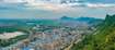 Mumbra_a scenic view of a city with mountains