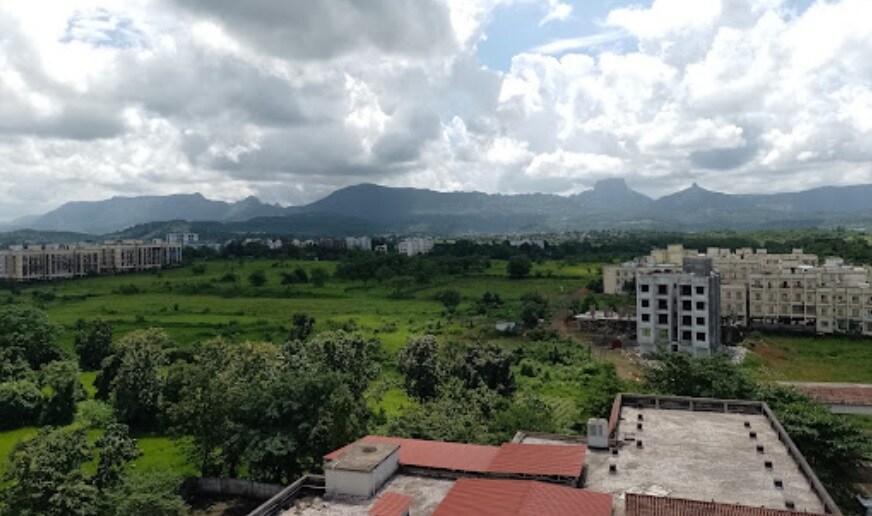 Vangani_a large building with a lot of trees on top of it