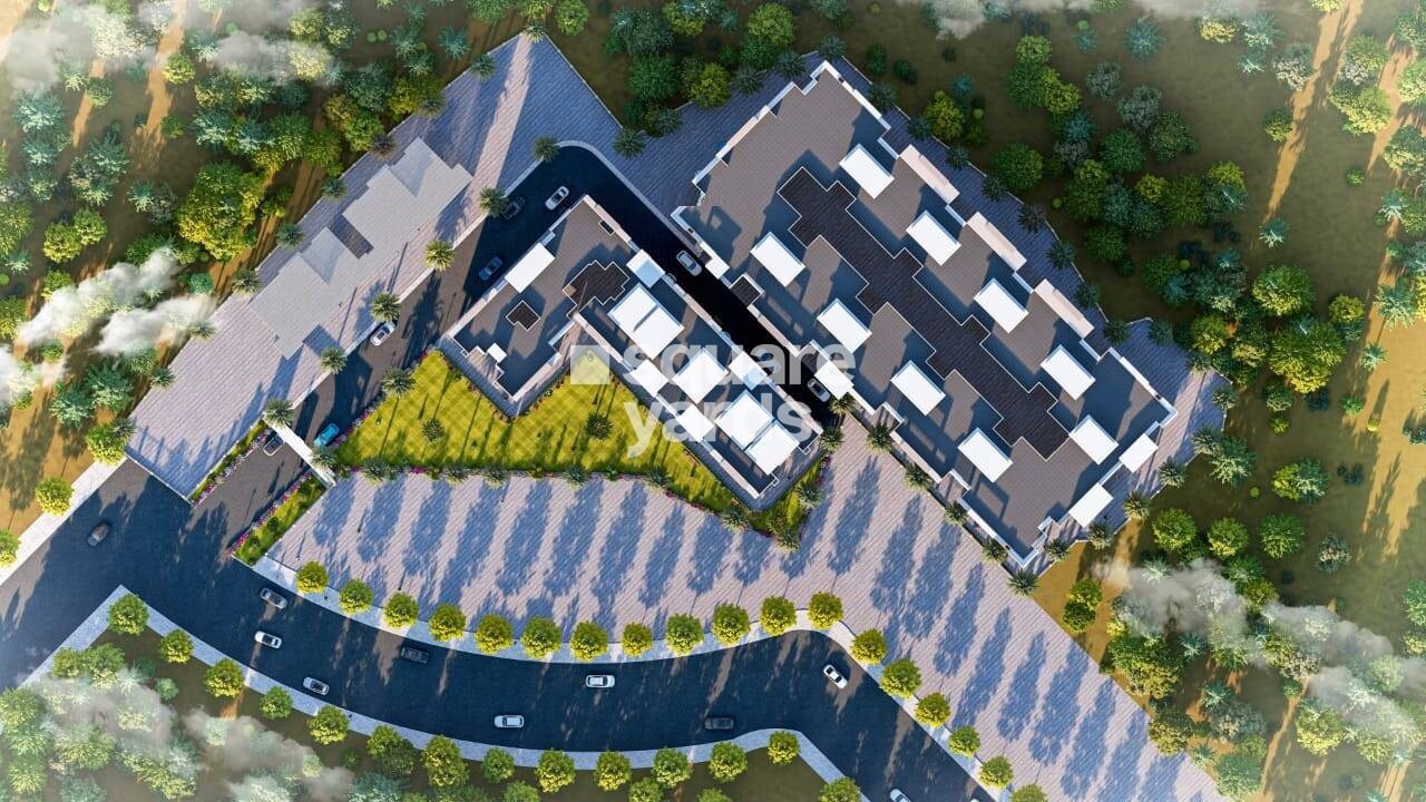 Laxmi-Shree-Sai-Residential-Park_an aerial view of a building with a plane flying over it