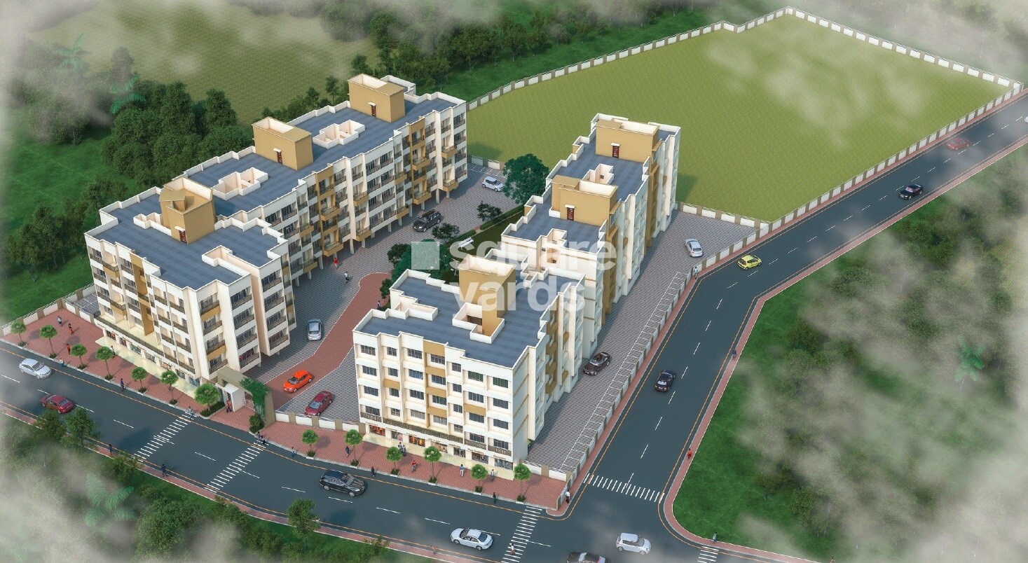 Patil-Vrindavan-Complex_a large building with a clock on top of it