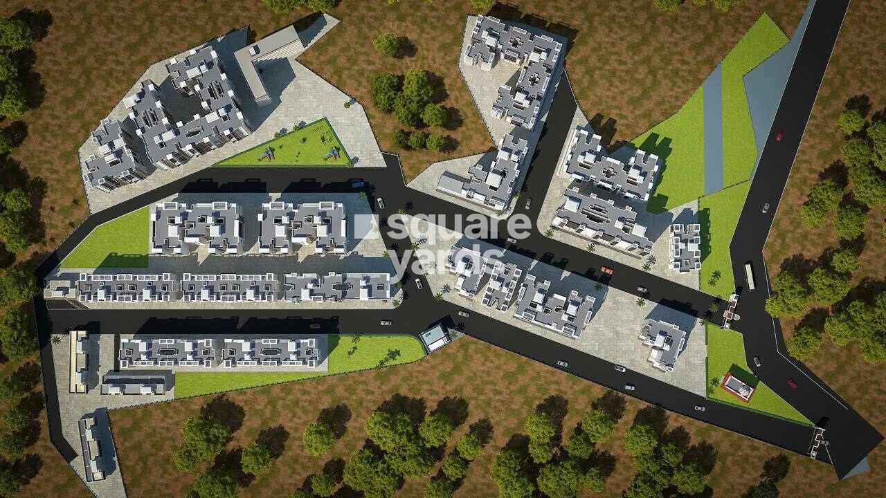 Shree-Township_an aerial view of a city with a plane flying over it