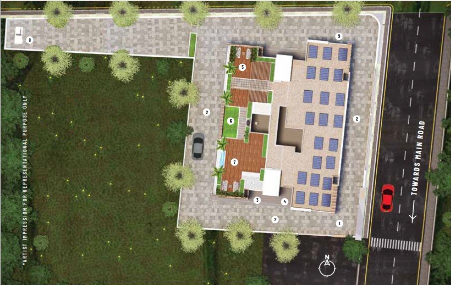 Anand-Eastwoods_an aerial view of a field with a large building