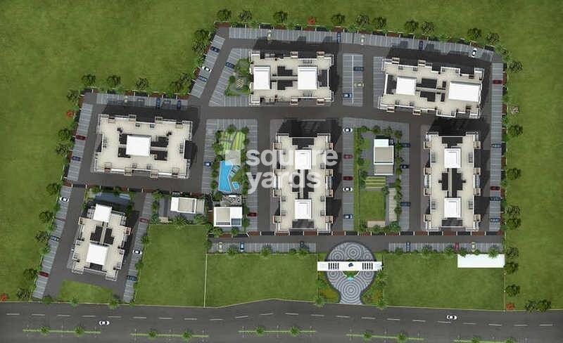 Calyx-Nikunj-Navyangan_a large building with a lot of windows on top of it
