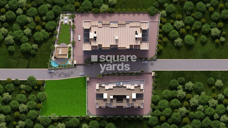 Gagan-Cascades_an aerial view of a rural area with houses and cars