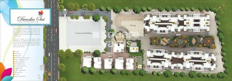 GK-Dwarka-Sai_an aerial view of a small town with a large building