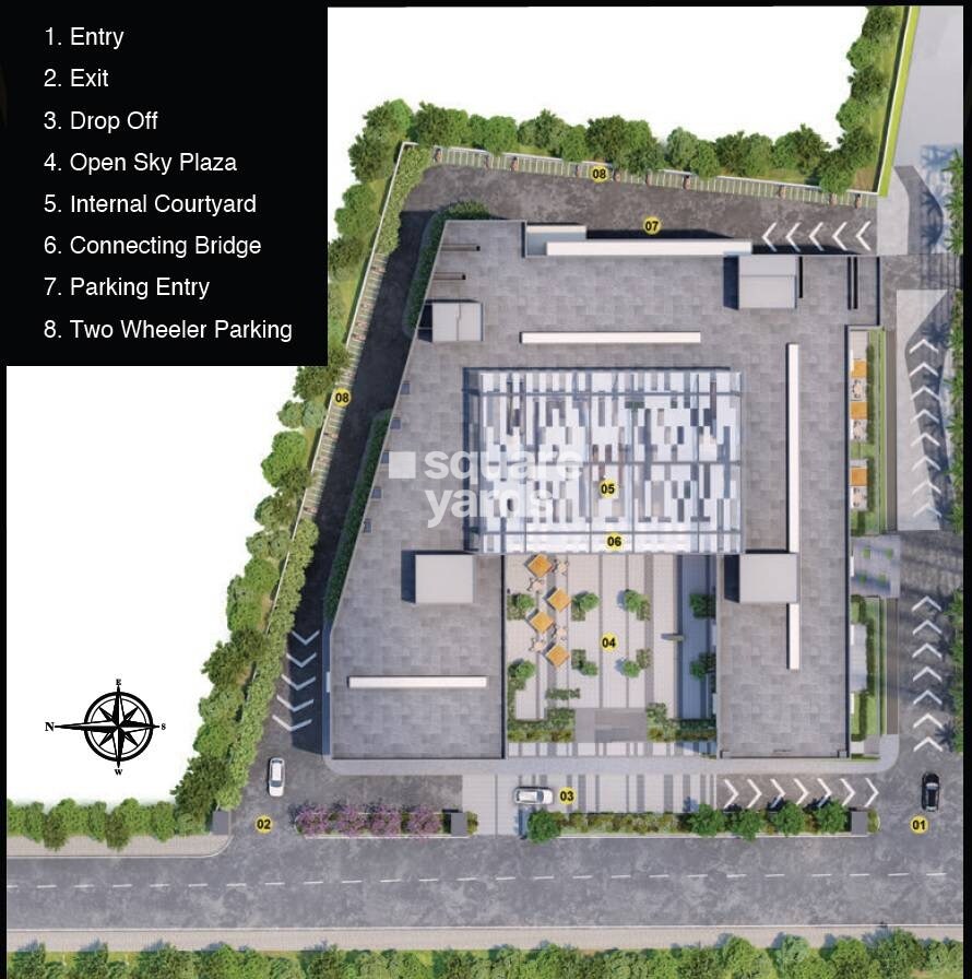 Godrej-Carnival_a large building with a clock on the side of it
