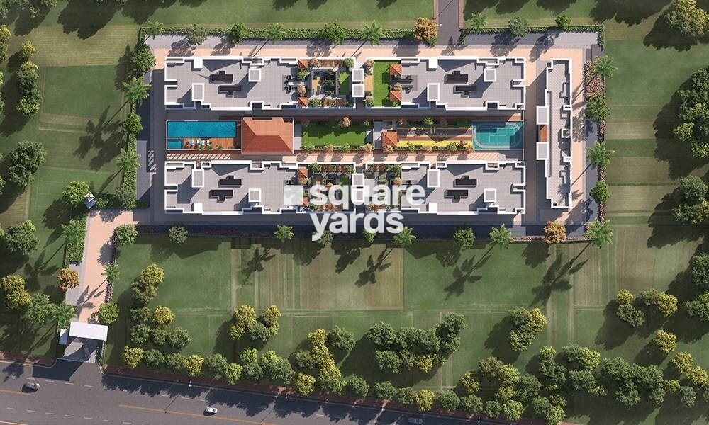 Jhamtani-Ace-Abode-Ravet_a large building with a lot of trees