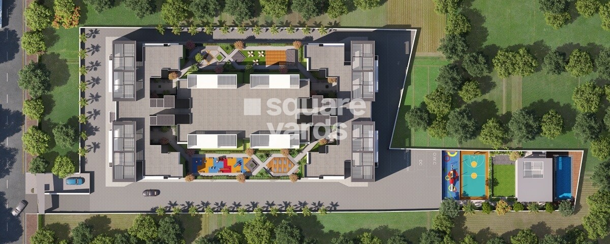 Nivasa-Elevia_an aerial view of a building with a plane flying overhead