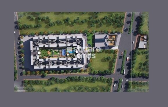 Pristine-Allure_an aerial view of a large building with a train on top of it