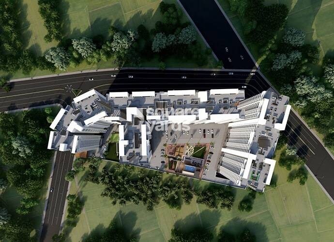 Renuka-Panchtattva_an aerial view of a large building with a train on top of it