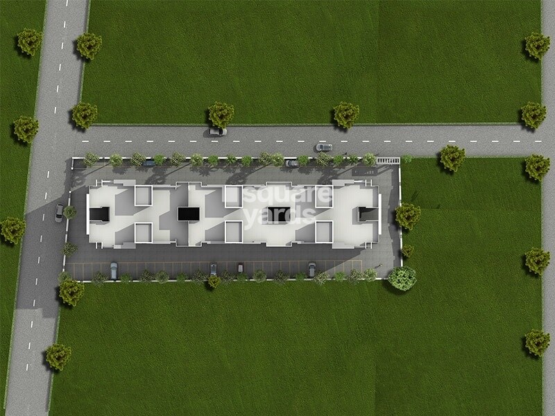 Sai-Bliss-Punawale_an aerial view of a building with a train on it