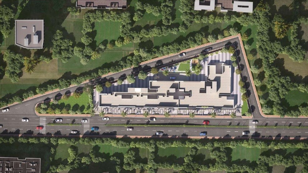 Shriram-Sky-Park_an aerial view of a large building with a train on it