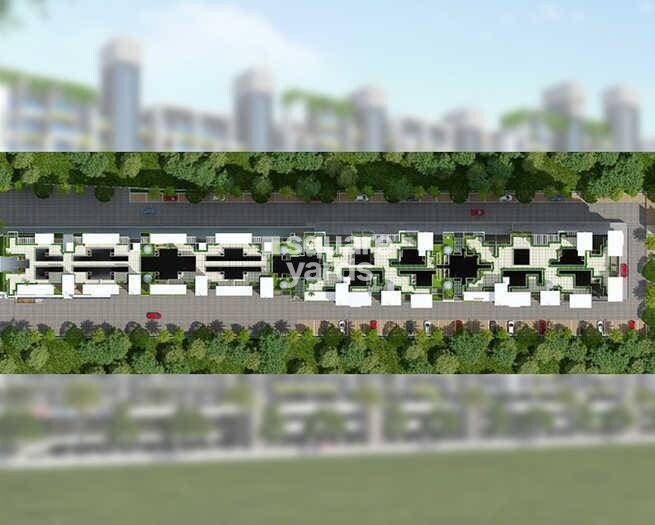 Somani-Towers_a large white building with a bunch of green grass around it