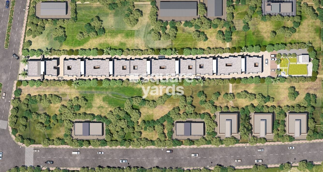 Sonigara-Shloka_an aerial view of a road with a train on it