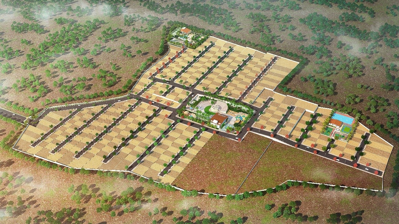 The-Laxmi-Paradise_an aerial view of a field with a large building
