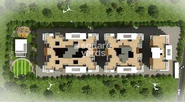 Tulsi-Ratna_a large building with a bunch of trees around it