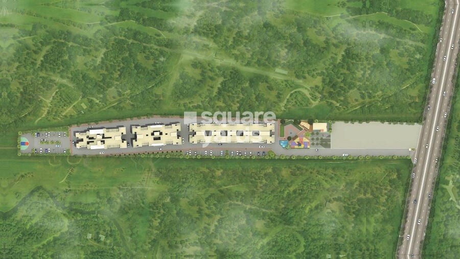 Vastushodh-Urbangram-Chakan_a train traveling through a lush green field