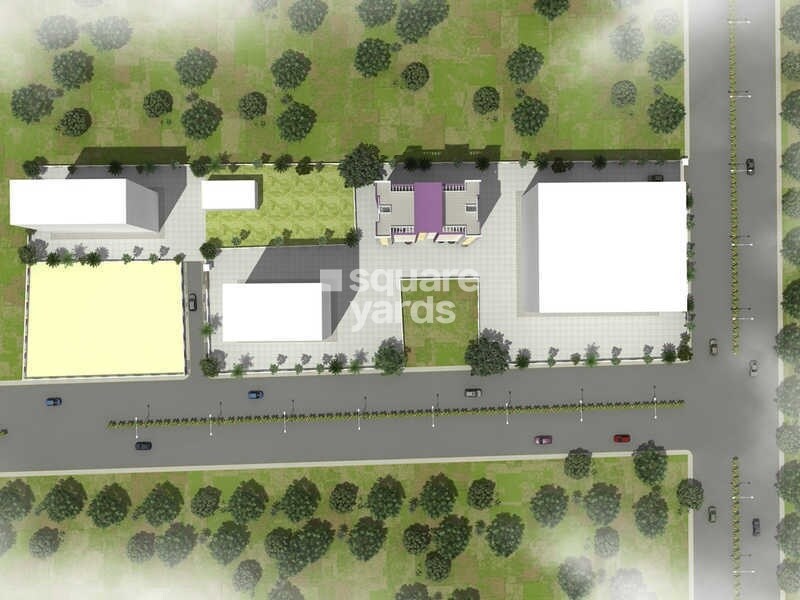 Venkatesh-Galaxy_an aerial view of a green field with a building