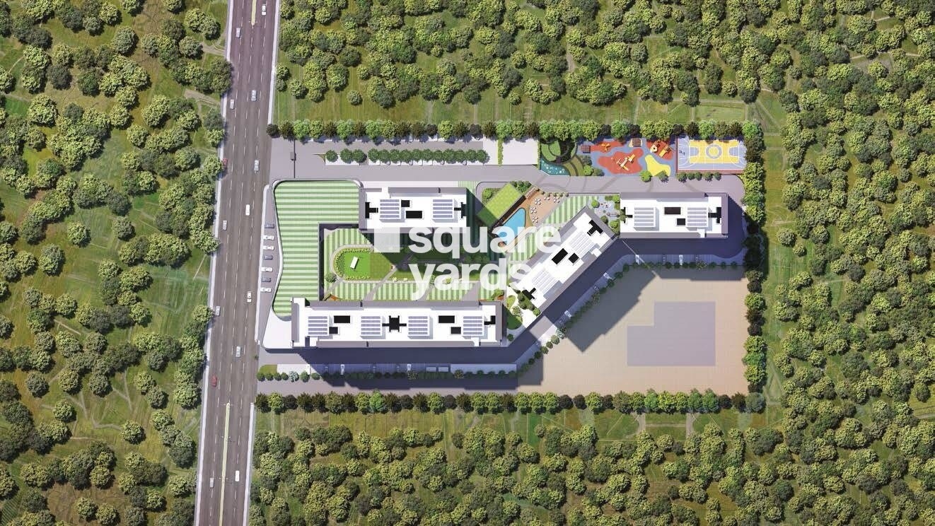 Vilas-Javdekar-Yashone-Eternitee_an aerial view of a grassy area with a train on it