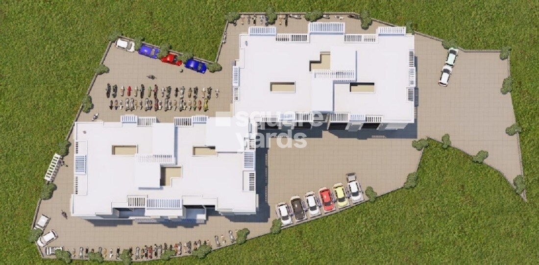 Jay-Biroba-Darshan_an aerial view of a large building with a plane flying over it