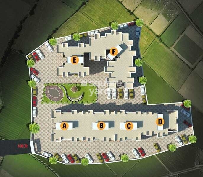 Maruti-Meadows_an aerial view of a building with a train on top of it