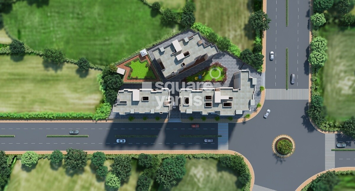 Rudis-Sunanda-Circle_an aerial view of a large building with a plane flying overhead