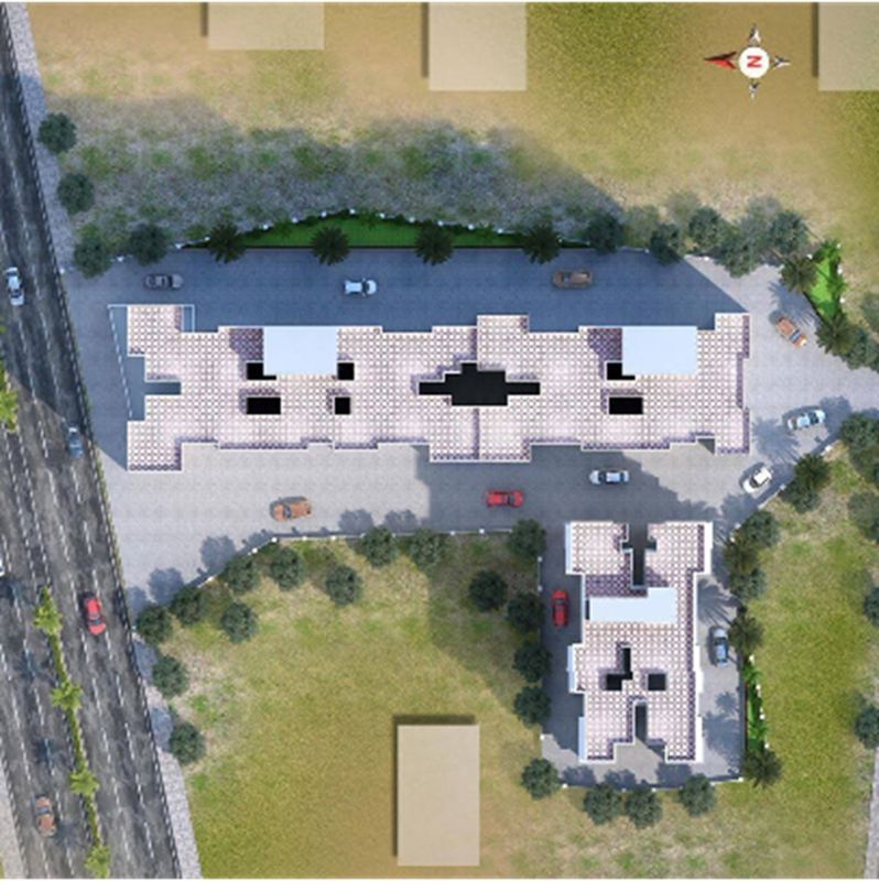 Shree-Trimurti-Bliss_an aerial view of a city with a plane flying over it